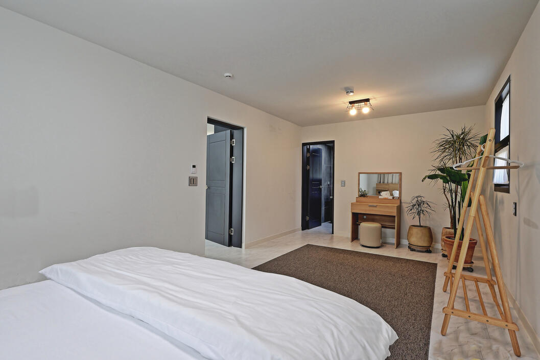 The master bedroom is spacious, private and relaxing. The master bedroom is spacious, private and relaxing.
