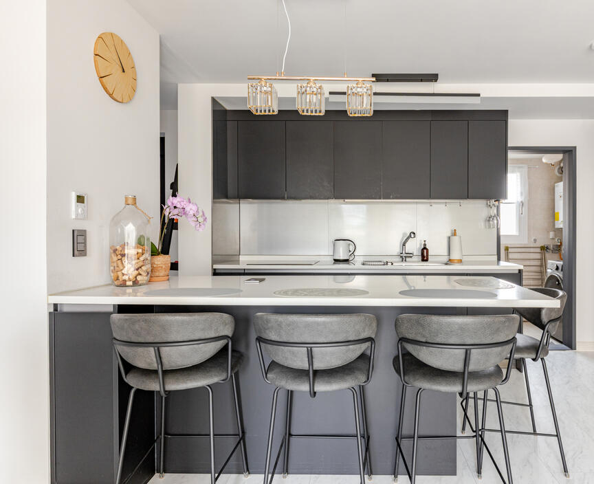 The dining and kitchen area. The open door on the side is the laundry room The dining and kitchen area. The open door on the side is the laundry room