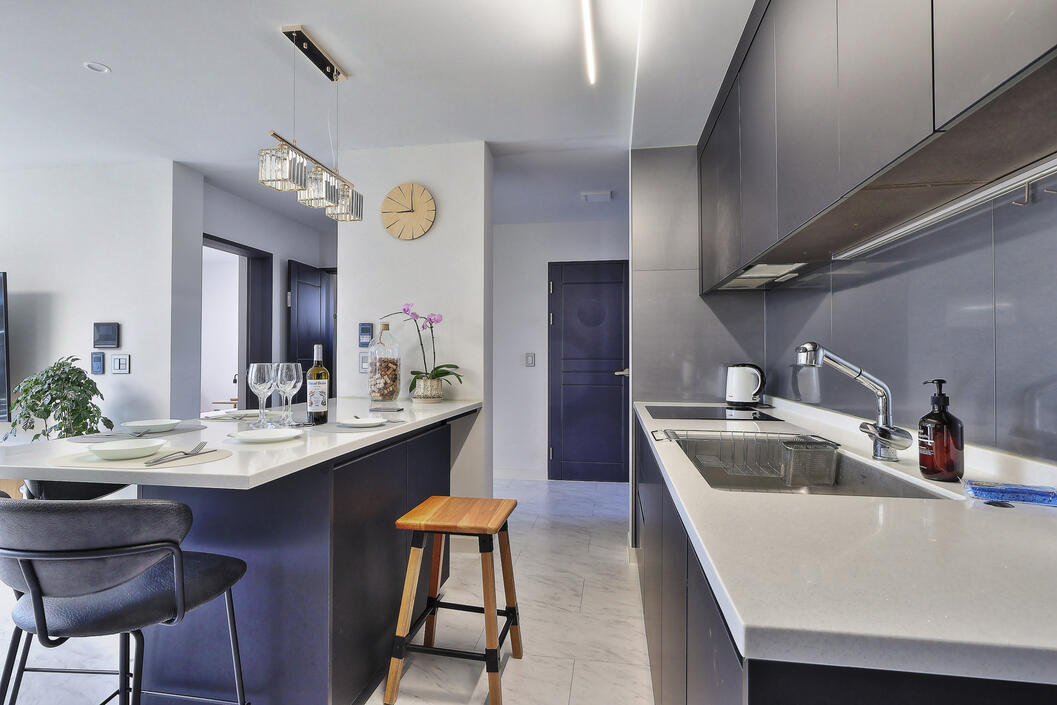 View of the kitchen and dining area, facing the entrance of the home. View of the kitchen and dining area, facing the entrance of the home.